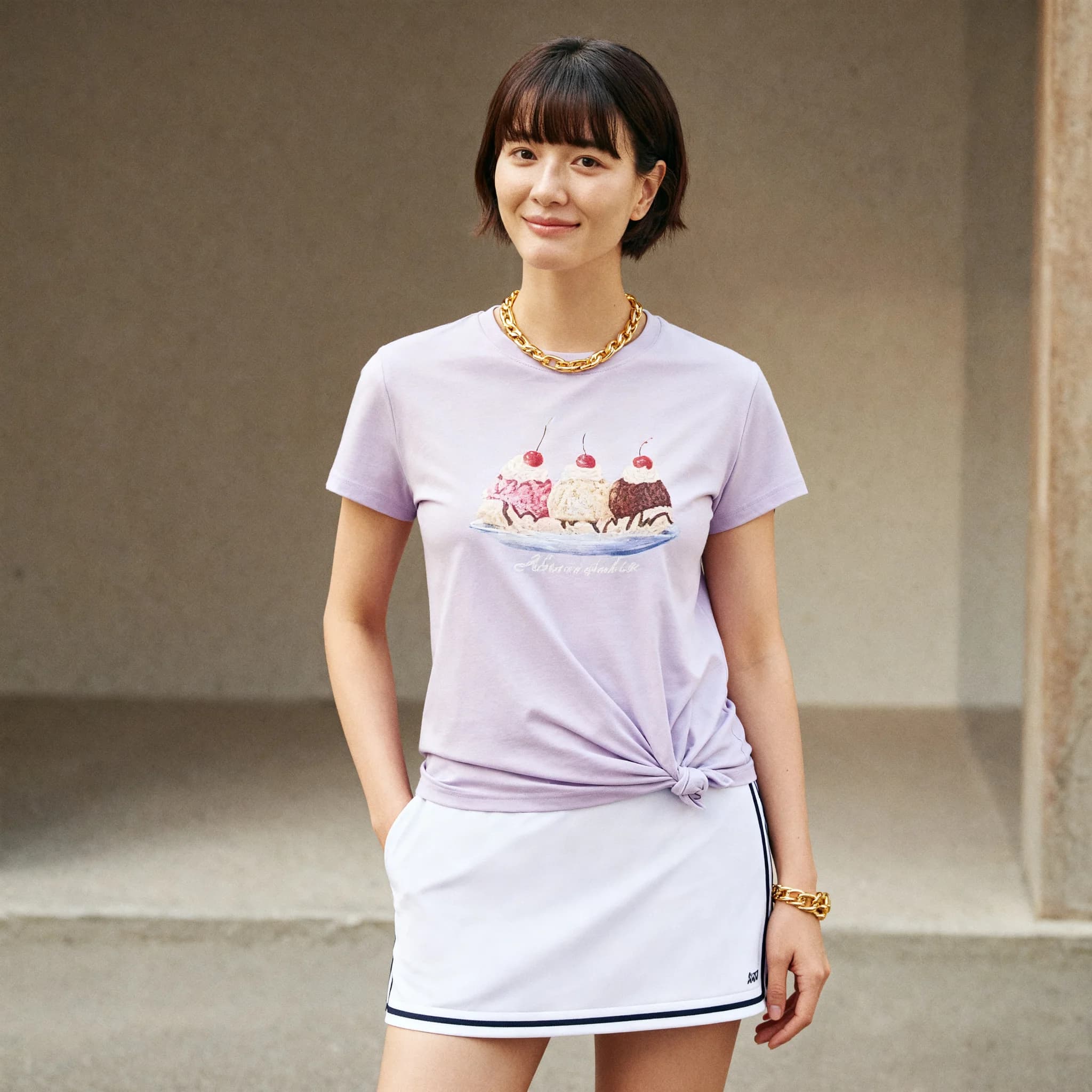 pink T-shirt — on model